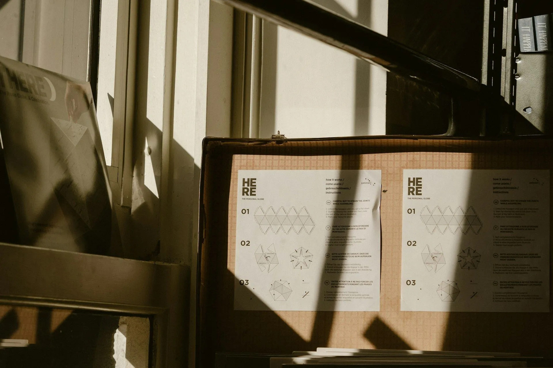 A neatly labeled box sitting in front of a window